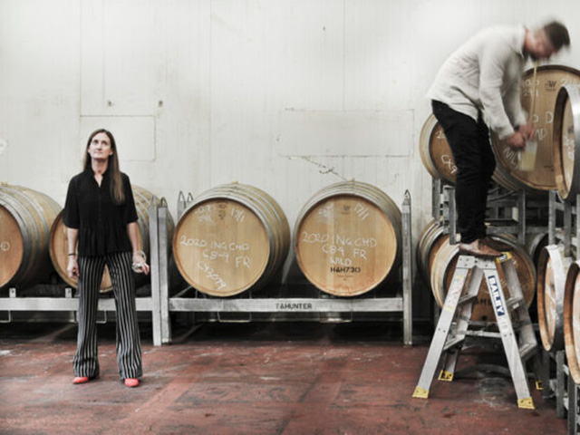 Damien and Jodie working in barrel room